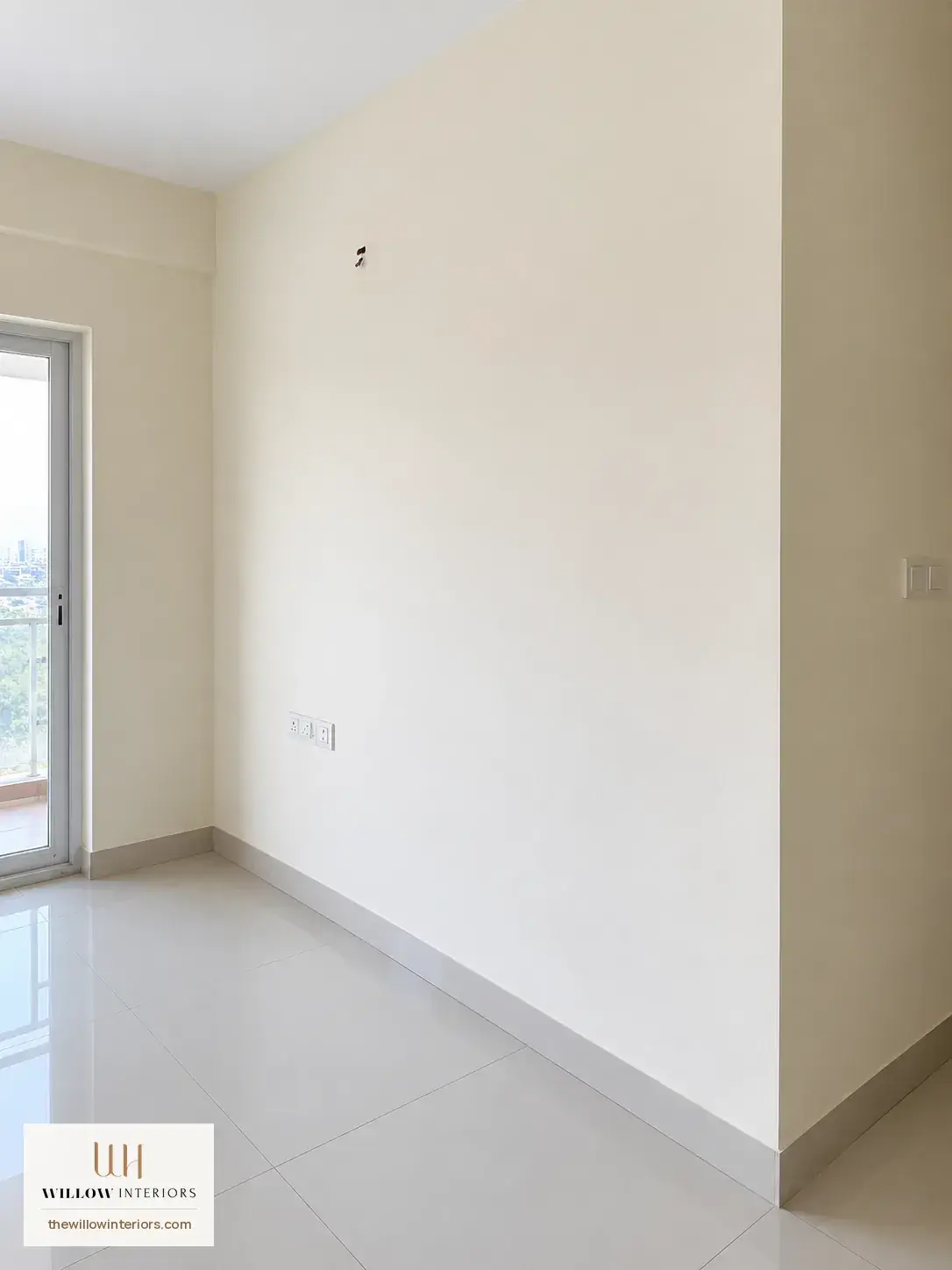 Living room of a Birla Apple Aroma 3BHK as handed over, before interiors (sofa wall)