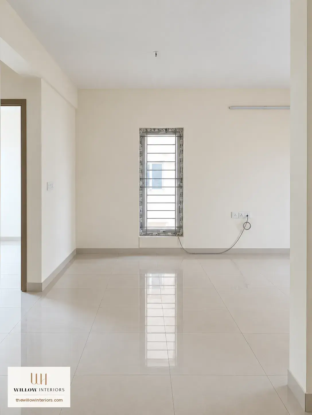 Living room of a Birla Apple Aroma 3BHK as handed over, before interiors (TV wall)