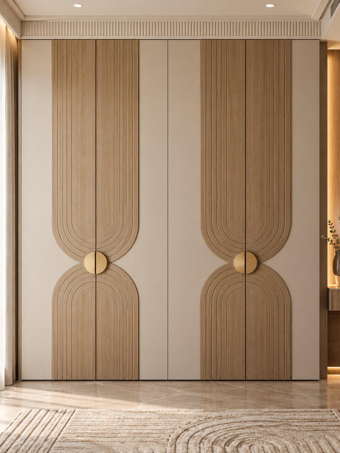 2026 wardrobe design idea: cream wardrobe with grooved wooden arch overlay panels and round brass handles, running into the loft — Willow Interiors concept render