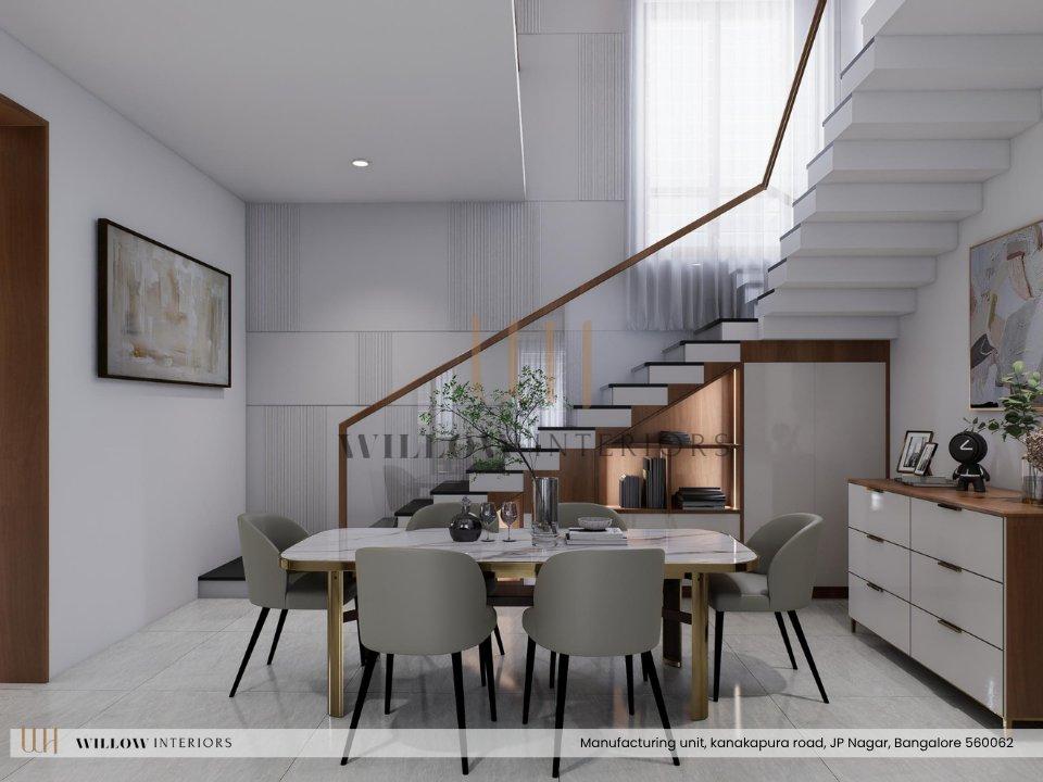 Dining area beside a floating staircase, with built-in storage under the stairs — 3D interior design for an independent house in Bangalore