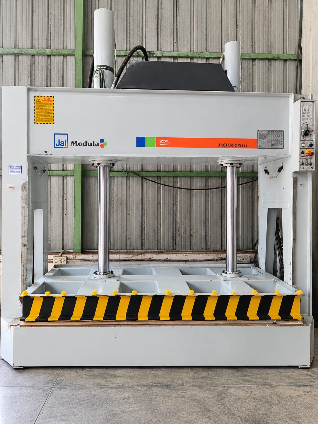 Cold press machine used to bond laminate evenly onto boards at Willow’s manufacturing unit
