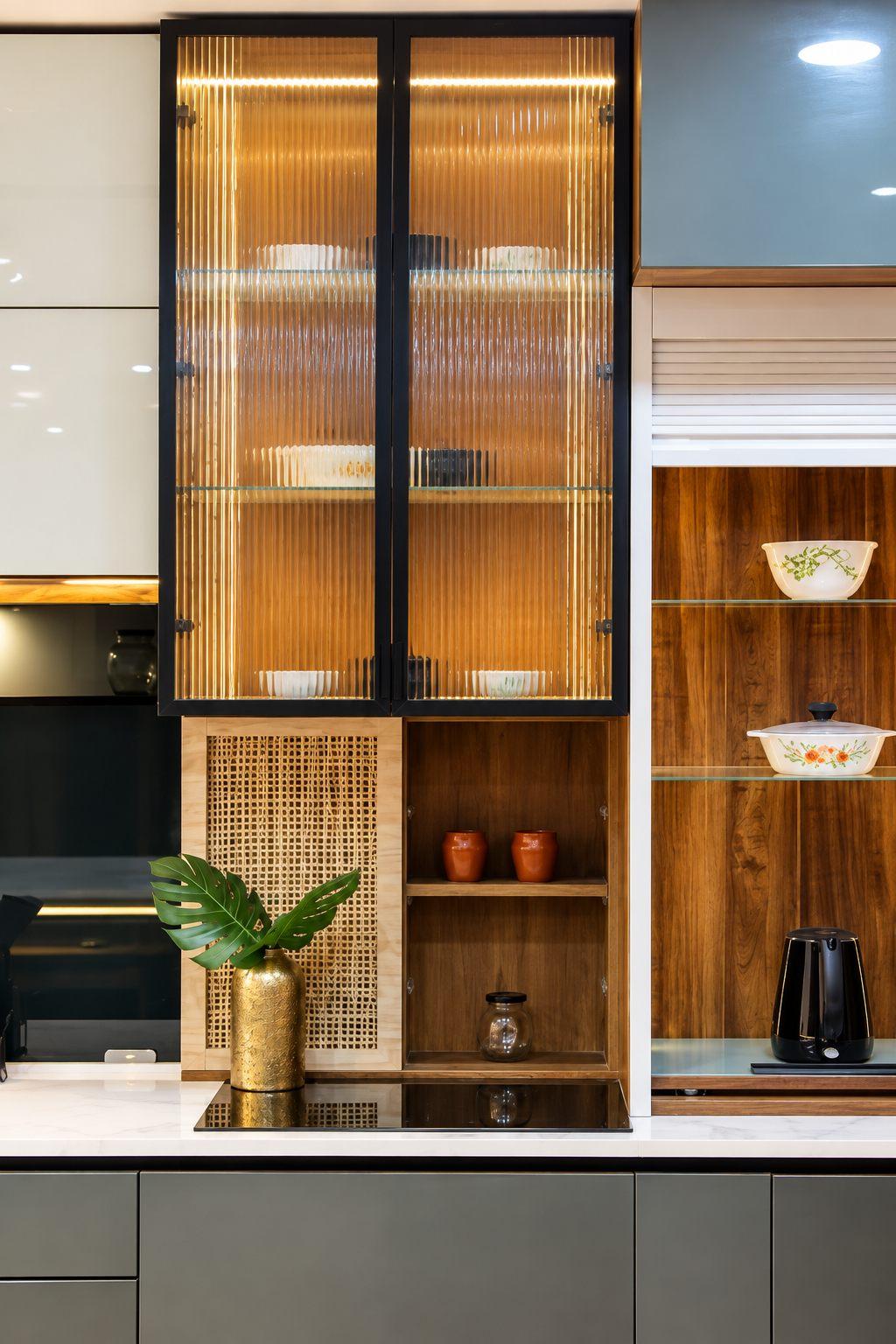 Lit crockery cabinet with fluted glass shutters and open shelves in Willow’s display studio