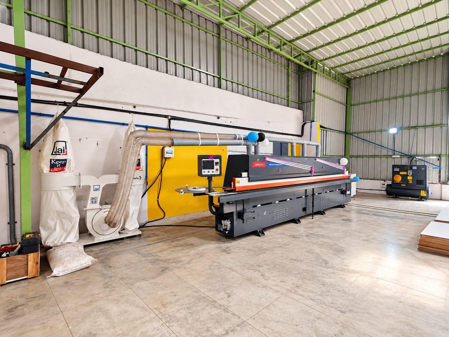 Edge banding machine with a pre-milling unit that trims each panel edge clean before the band is applied, for a flush, durable finish