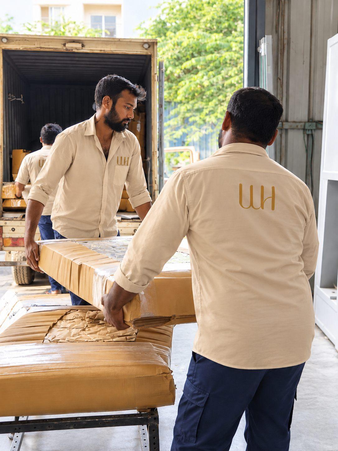 Individually packed modular furniture panels being loaded for delivery and on-site assembly