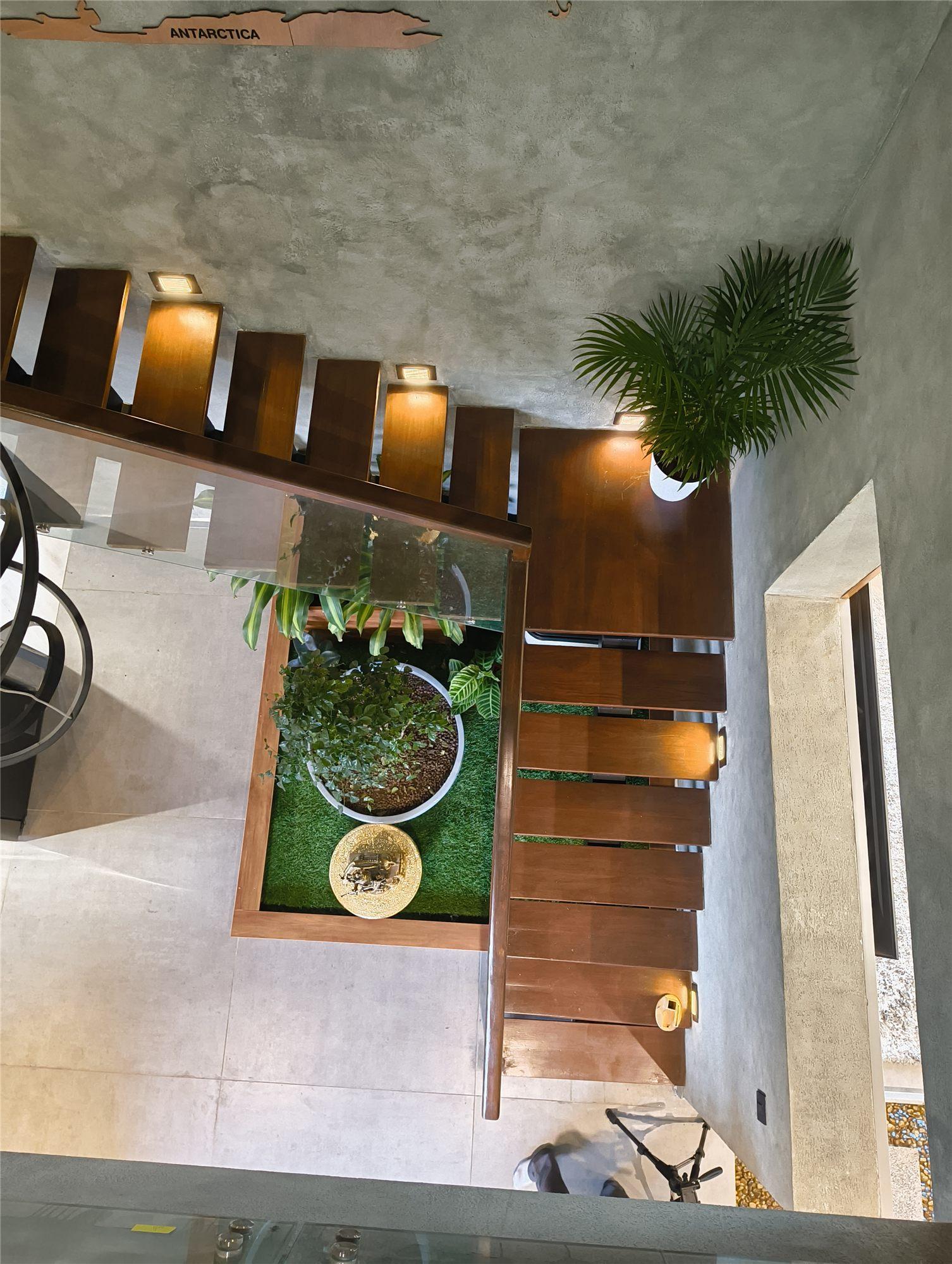 Gubbi Gudu villa, Anjanapura, Bangalore — internal courtyard and indoor garden seen from the staircase