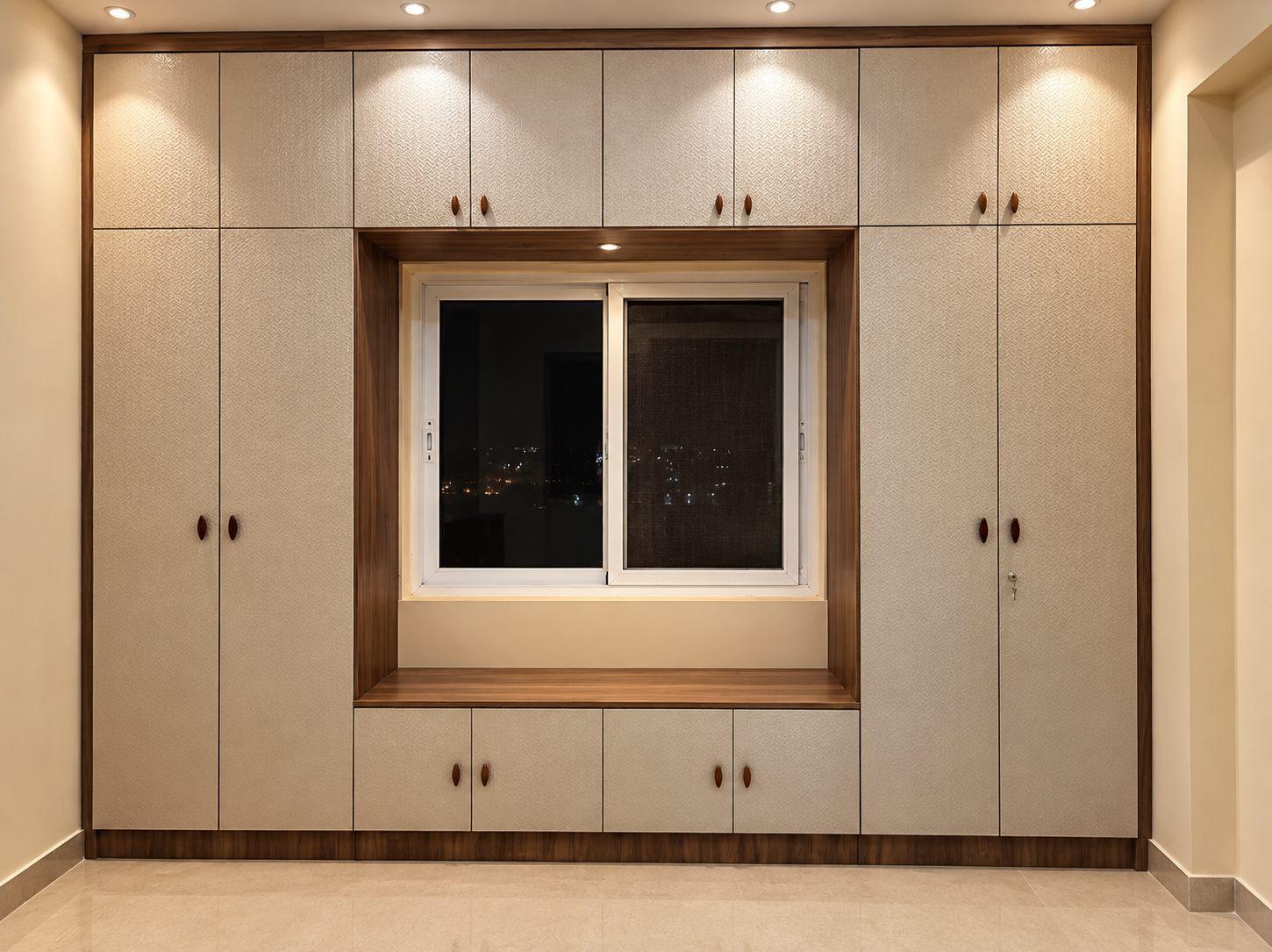 Guest bedroom wardrobe in beige laminate built around the window, with a window-seat ledge, lofts and small wooden knobs
