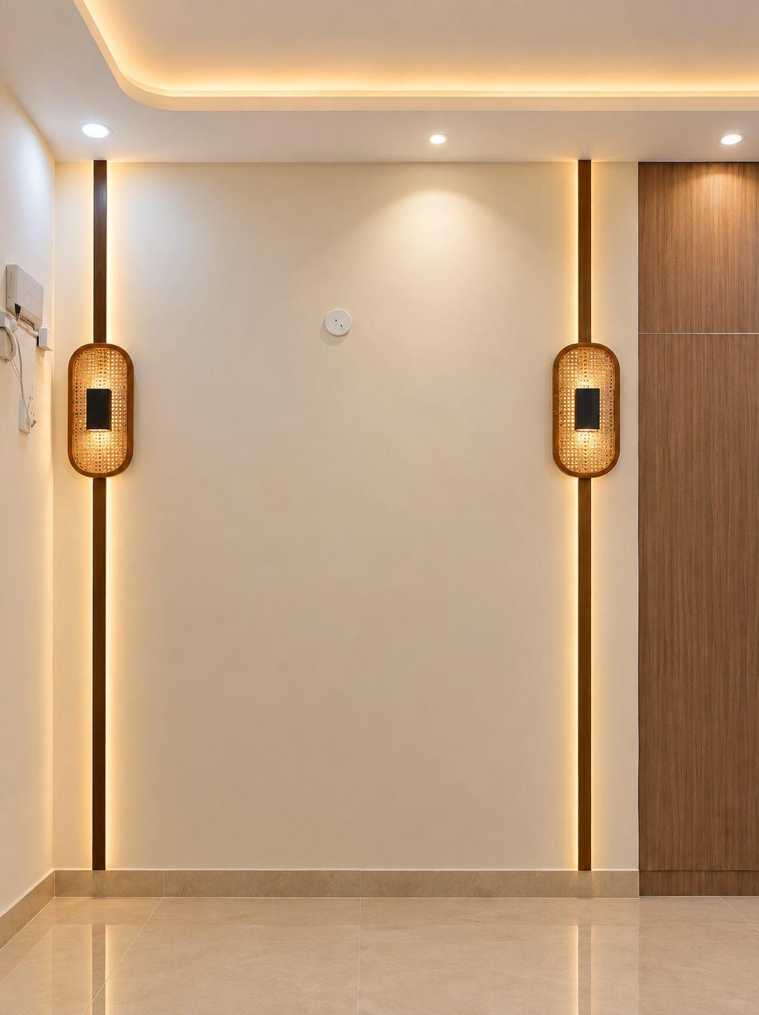 Living area wall panel in cream with two vertical profile light strips, woven wall sconces and a cove-lit false ceiling