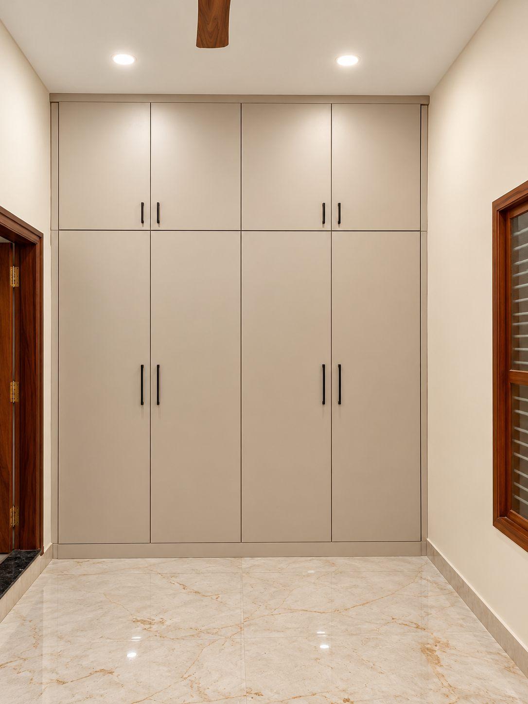 Kids’ bedroom wardrobe in beige with lofts — Saral Mane, a G+2 house on Kanakapura Road, Bangalore
