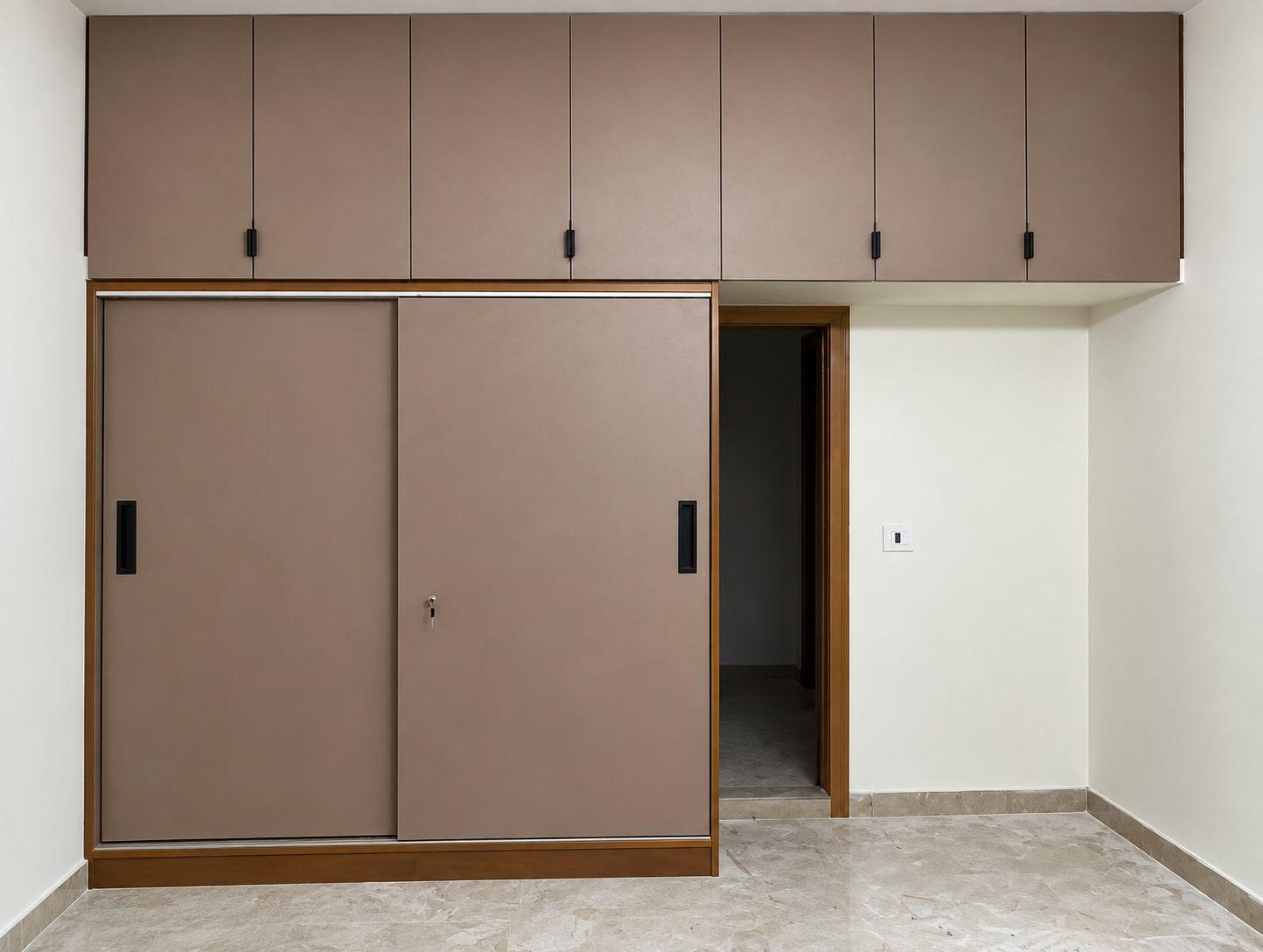 Taupe sliding-door wardrobe with matching lofts above